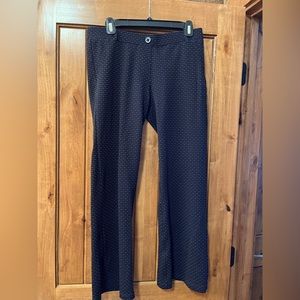 Betabrand boot cut yoga dress pant in navy with small white flecks.